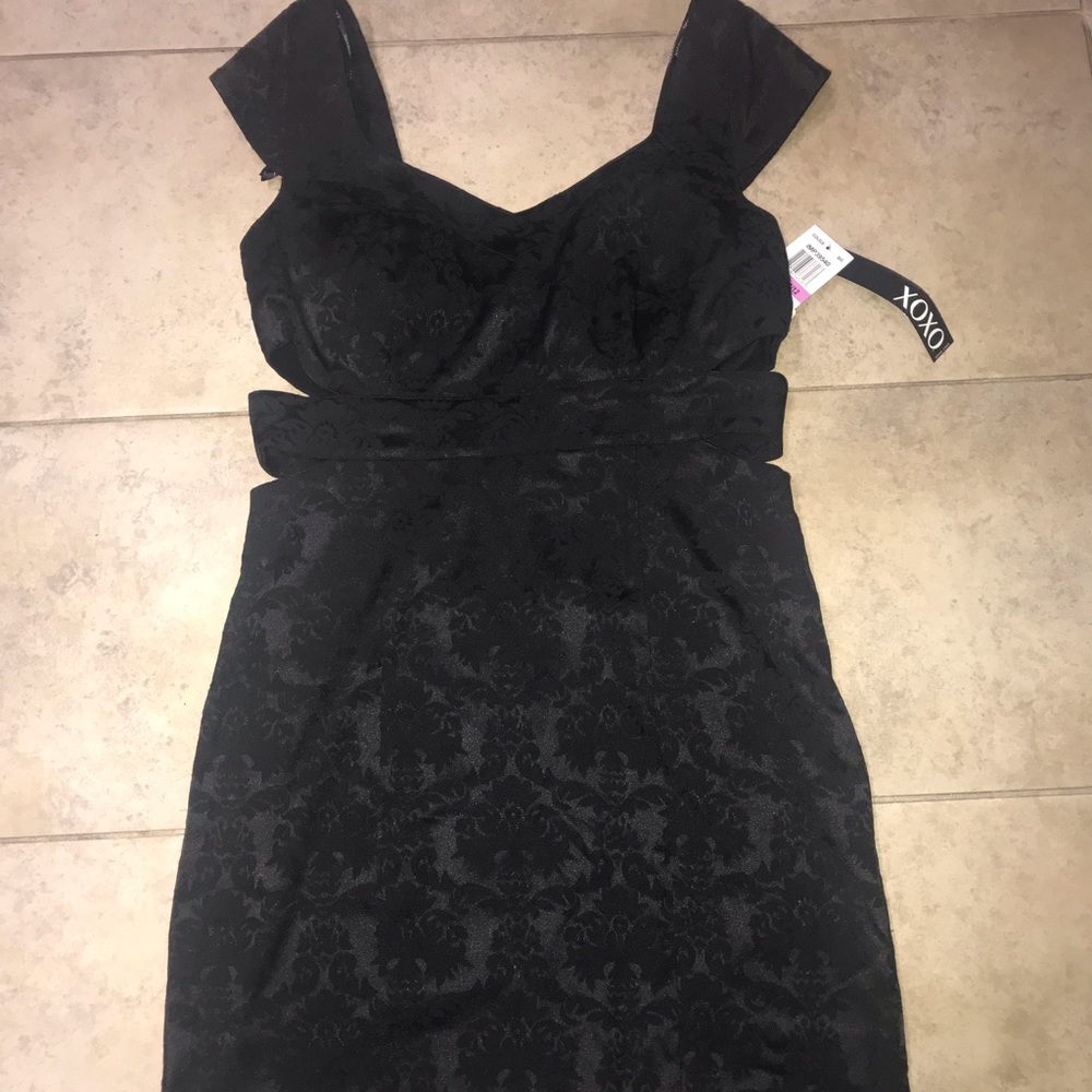 A black paisley XOXO side cut out mini dress.